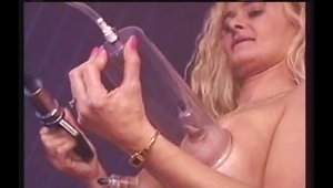 A Sexy, Kinky Cougar Uses A Pump On Her Pierced Nipples