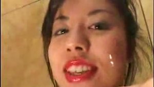 Asian Chick Kisses And Licks Camera